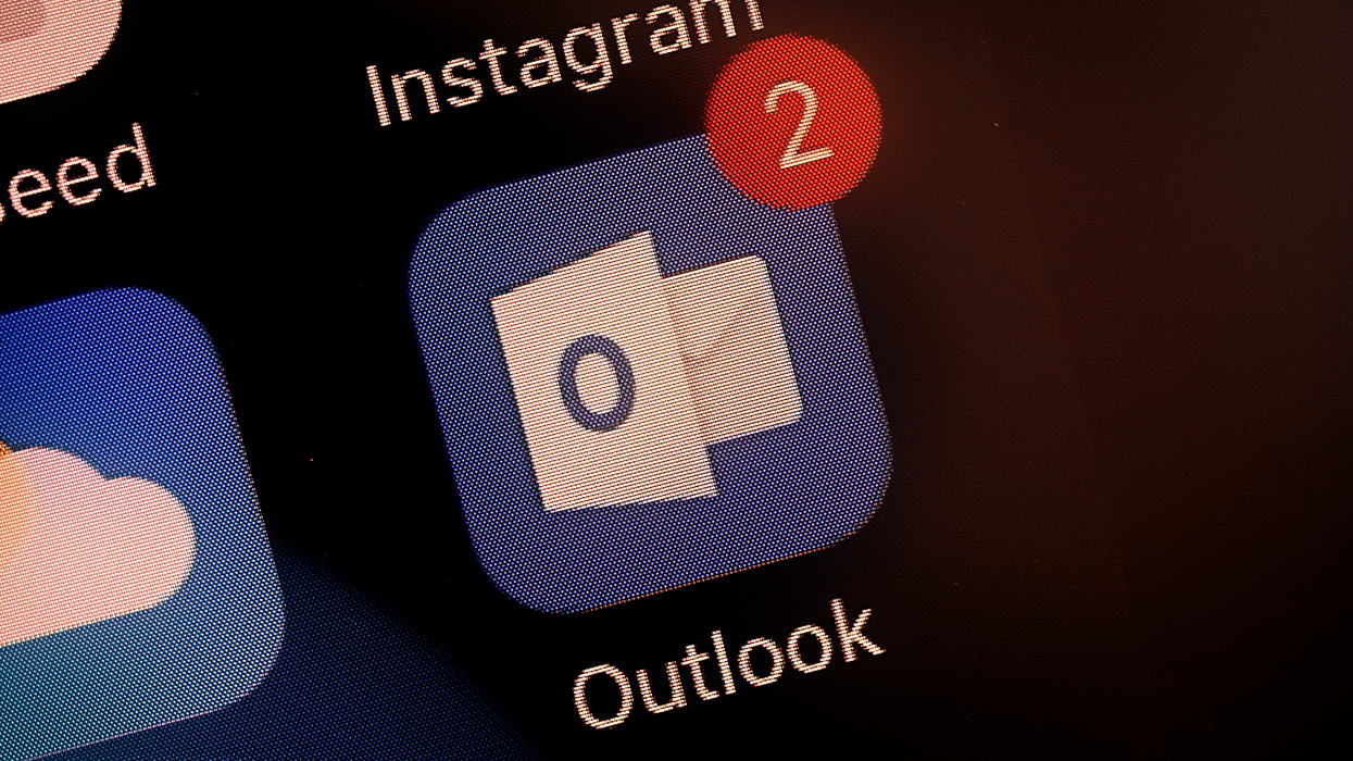 outlook email icon pictured on the iphone homescreen