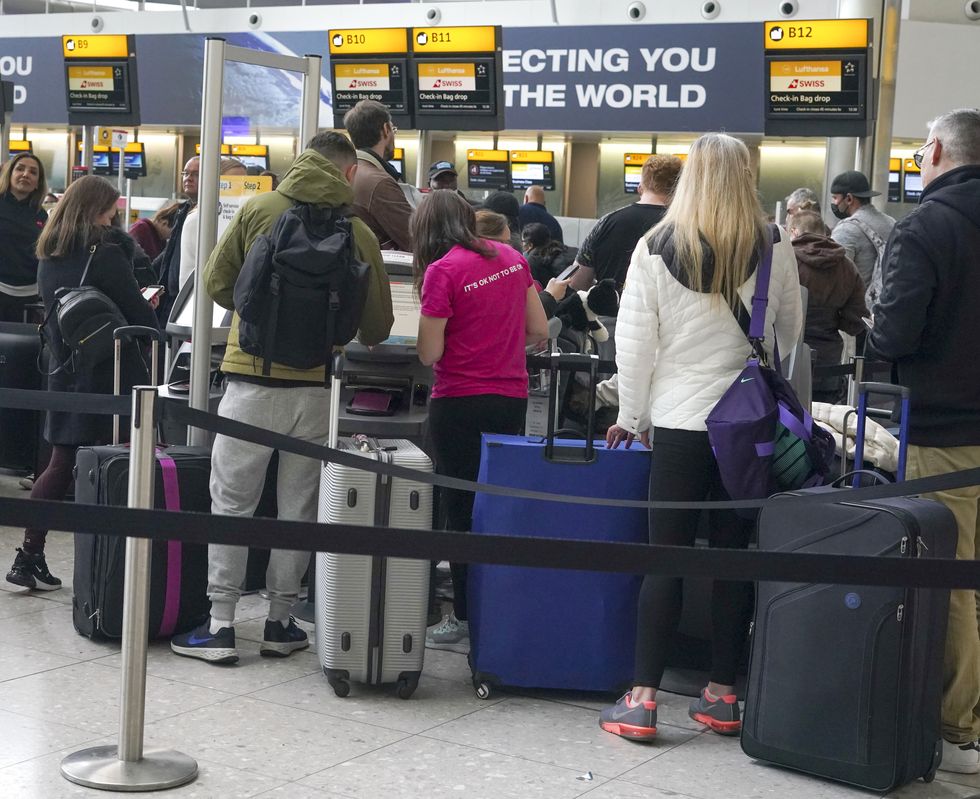 PA File Photo of People queuing to check-in at Heathrow Terminal 2 as travellers embarking on overseas trips on Monday faced chaos as flights were cancelled and cross-Channel rail services were hit by major delays. Airlines are suffering from staff shortages related to coronavirus sickness, leading to flights being grounded. Picture date: Monday April 4, 2022. See PA Feature TRAVEL Delays. Picture credit should read: Steve Parsons/PA. WARNING: This picture must only be used to accompany PA Feature TRAVEL Delays.