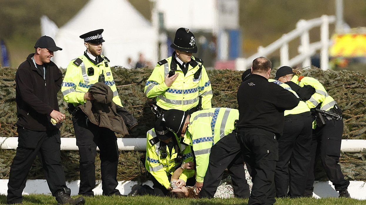 Grand National DELAYED as protesters storm Aintree course amid huge police presence