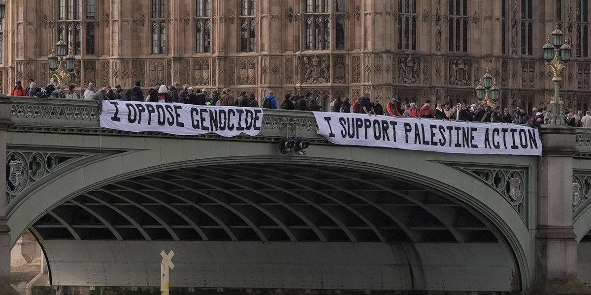 NextImg:Six people arrested after draping Westminster Bridge with Palestine Action banner