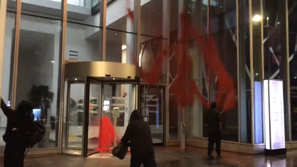 Palestine Action throw paint at building in Manchester