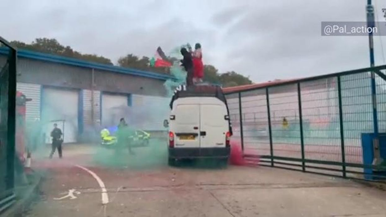 WATCH: Protesters throw flares as masked protesters infiltrate drone factory - three arrested