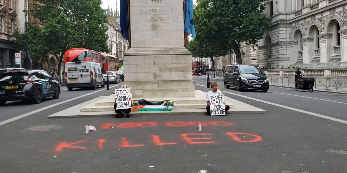 NextImg:Palestine protesters drape flag over steps of Cenotaph and spray graffiti on road