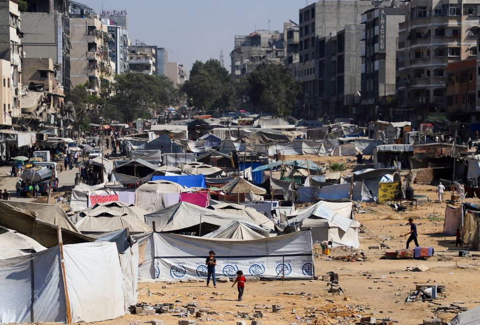 Palestinians, displaced by the Israeli military offensive, take shelter in a tent camp,u200b