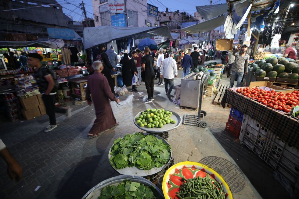 Palestinians go food shopping during Eid in the Gaza Strip