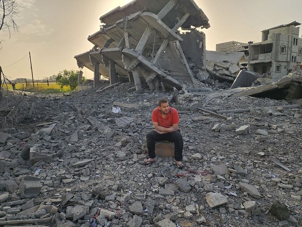 Palestinians inspect the area after Israeli attack over Khan Yunis, Gaza \u200b