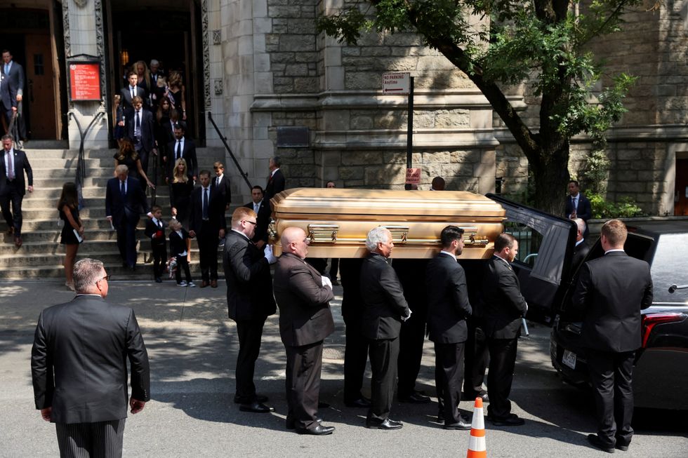 Pallbearers put the casket of Ivana Trump, socialite and first wife of former U.S. President Donald Trump, into a hearse outside St. Vincent Ferrer Church, in New York City, U.S., July 20, 2022. REUTERS/Brendan McDermid