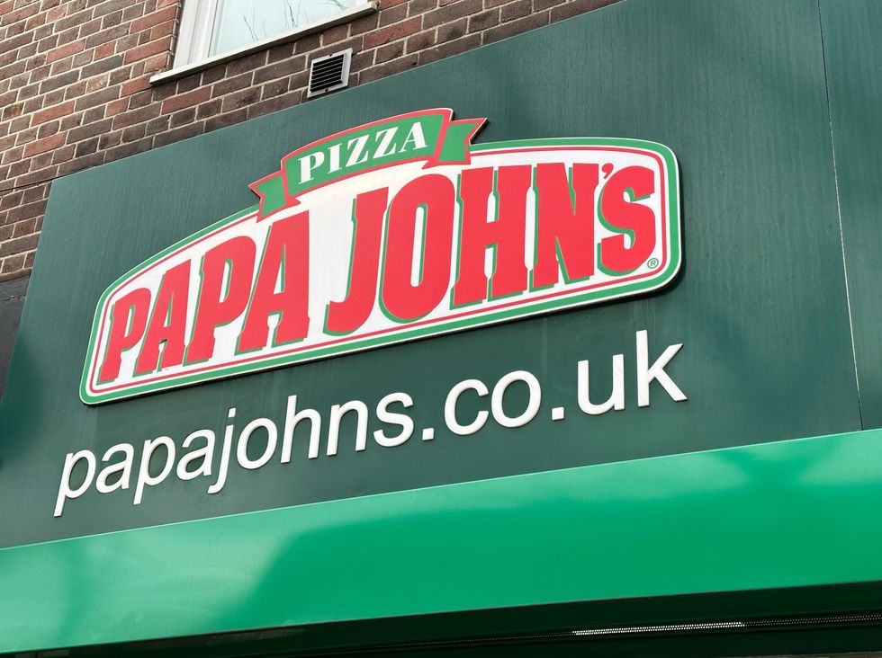 Papa John's pizza chain logo outside UK store