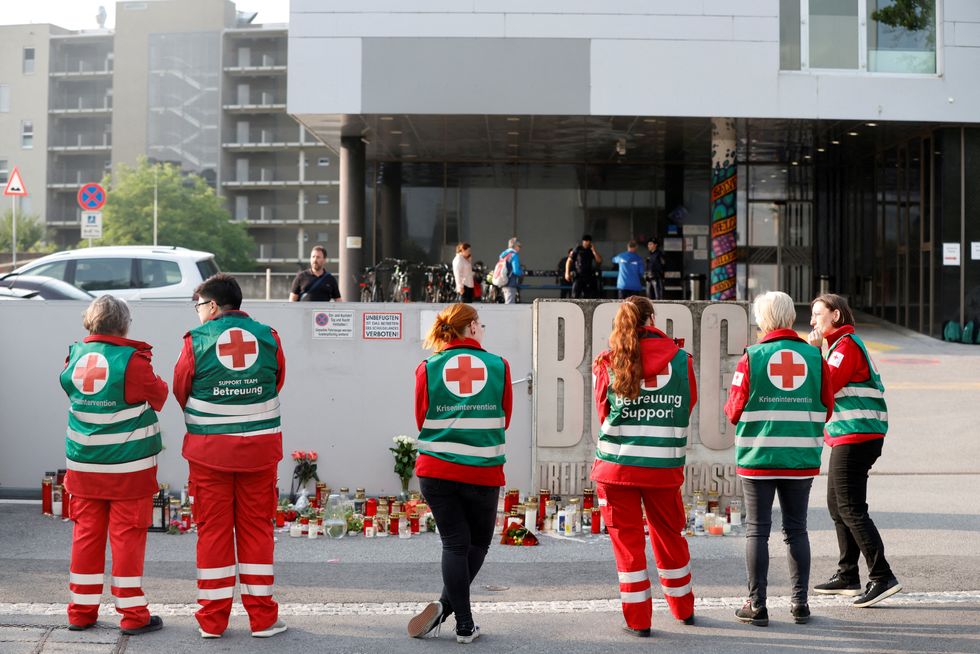 Paramedics standing in front of the school after the attack unfolded