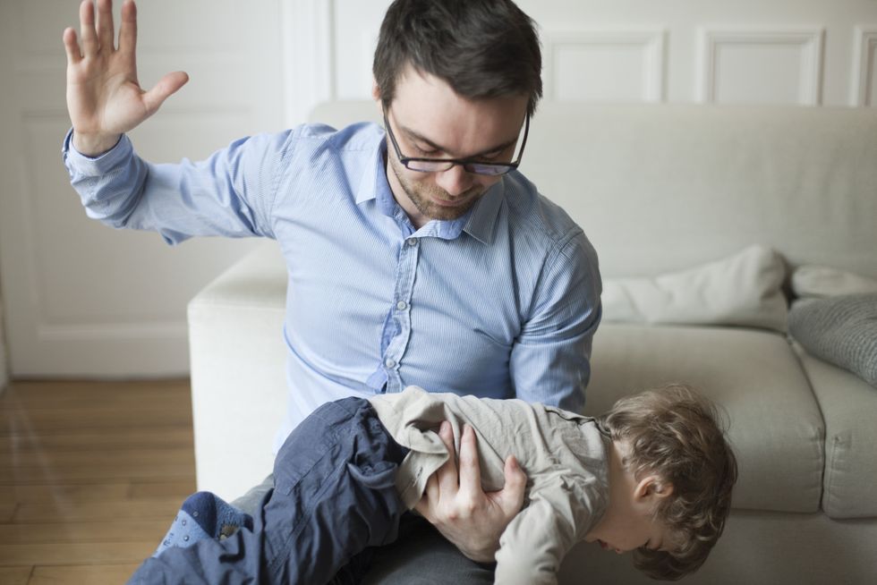 Parent smacking child