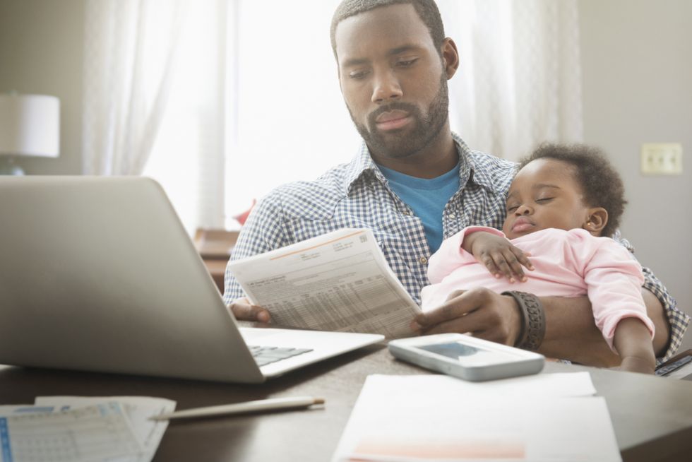 Parent with child looking at letter