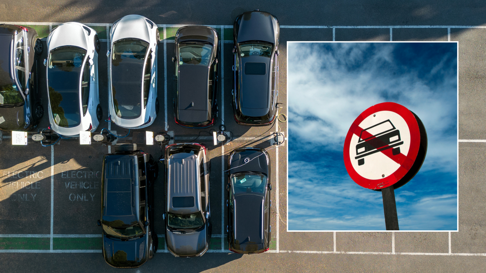 Parked car and car ban sign