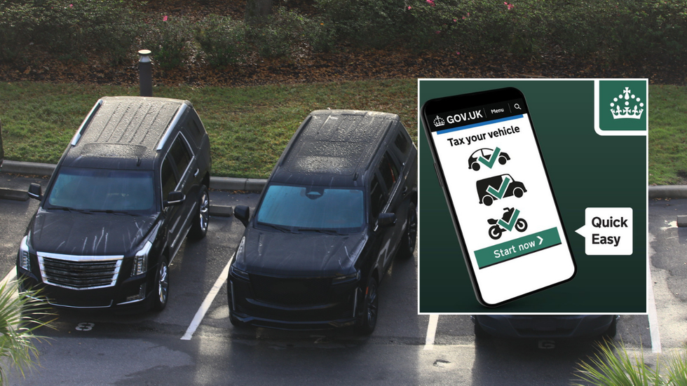 Parked SUVs and car tax sign
