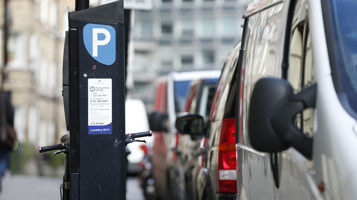 Parking machine near cars