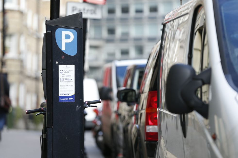Parking machine near cars