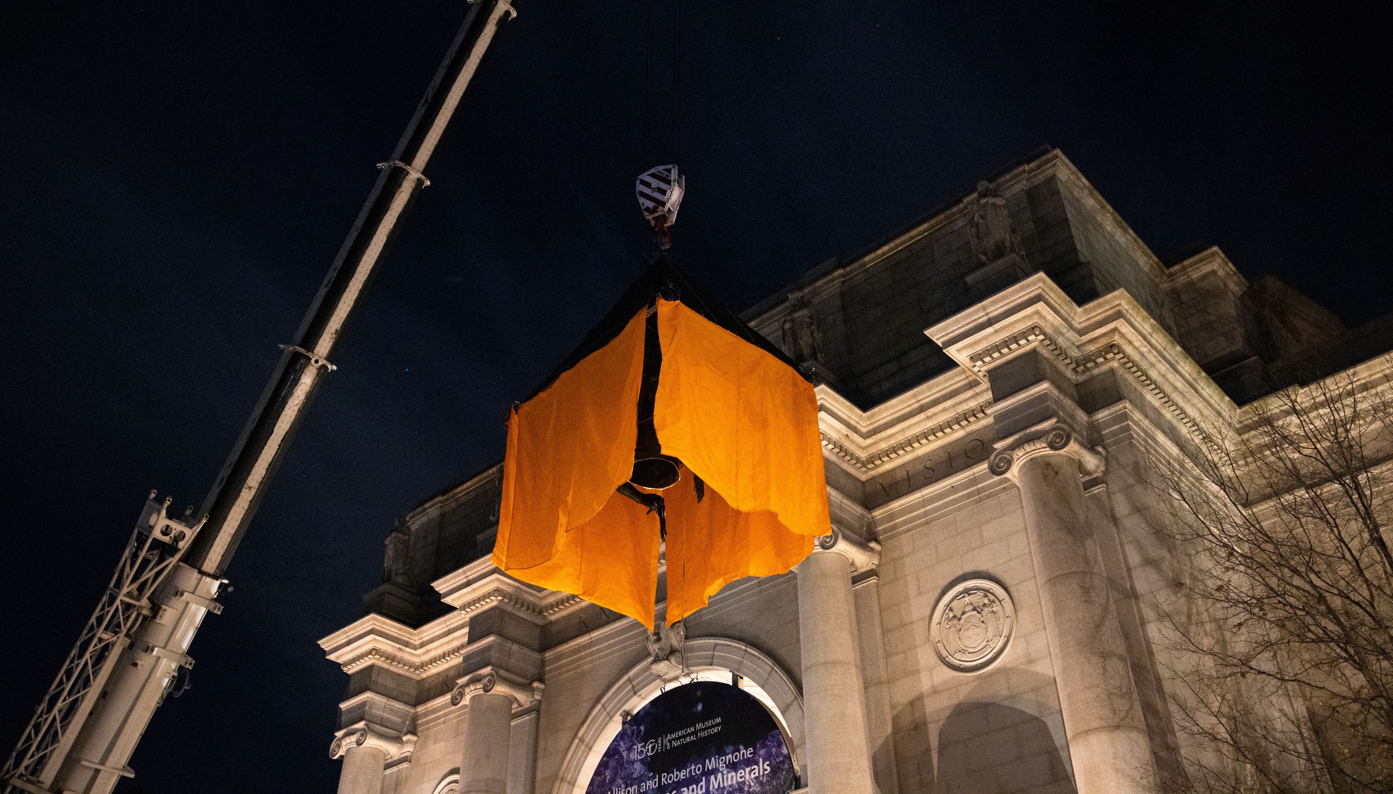 Part of a statue of Theodore Roosevelt is removed from the steps outside the American Museum of Natural History after the museum proposed to move following objections from some that it was a symbol of colonialism in New York City, New York