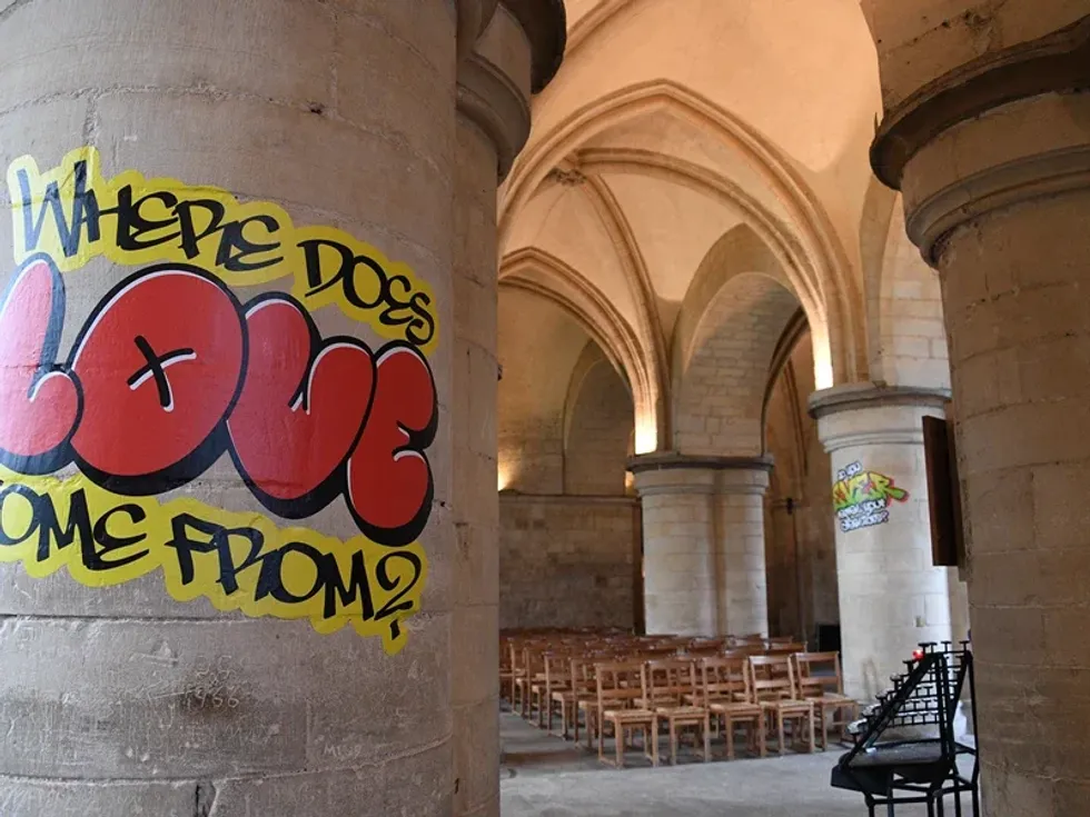 Part of the graffiti reads: 'Where does love come from?'