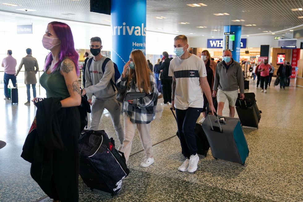 Passengers arriving at Birmingham Airport, as forty-seven countries were removed from the red list, meaning arrivals from those locations will no longer need to spend 11 nights in a quarantine hotel. Picture date: Monday October 11, 2021.