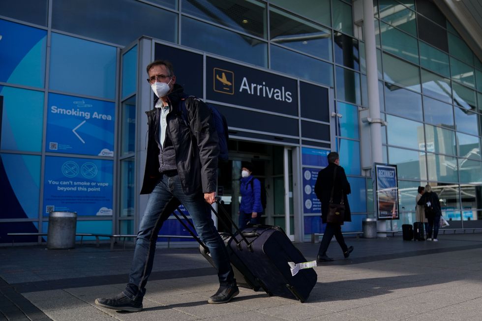 Passengers arriving at Birmingham Airport, as forty-seven countries were removed from the red list, meaning arrivals from those locations will no longer need to spend 11 nights in a quarantine hotel. Picture date: Monday October 11, 2021.