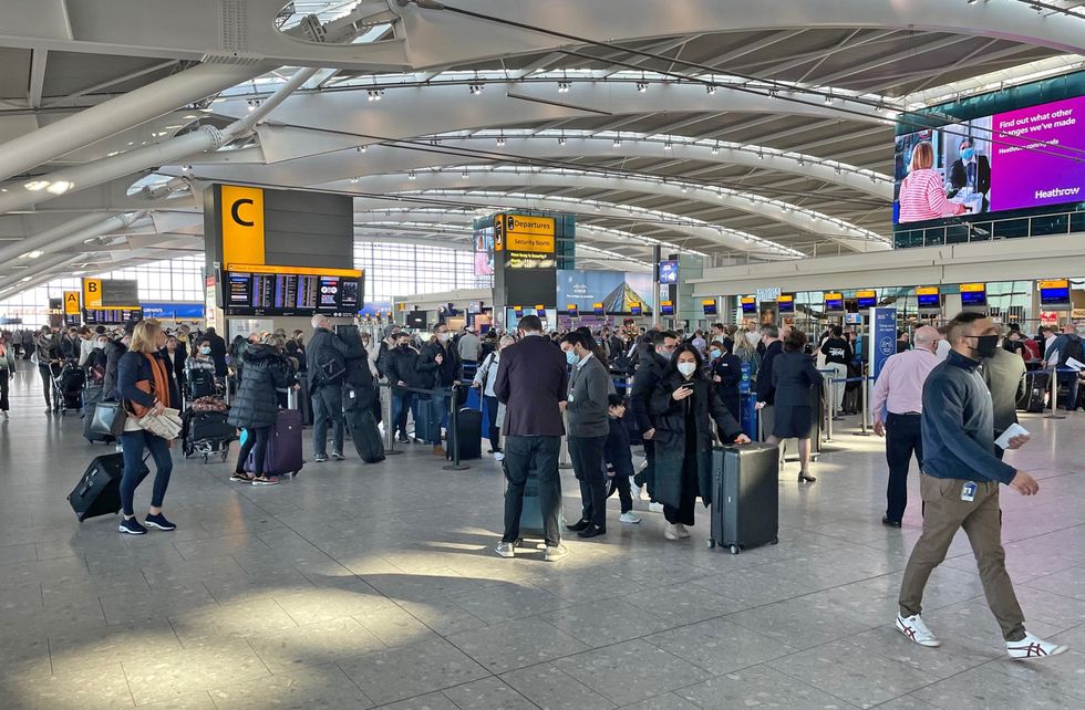 Passengers at Heathrow Airport T5, London, as British Airways has cancelled all short-haul flights from the airport until midday and further disruption is expected throughout Saturday due to ongoing technical issues. Picture date: Saturday February 26, 2022.