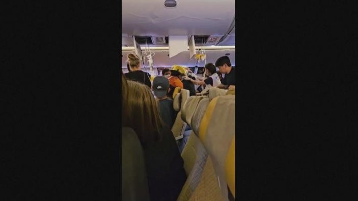 WATCH: Passengers carried out flight SQ321 after emergency landing in Bangkok