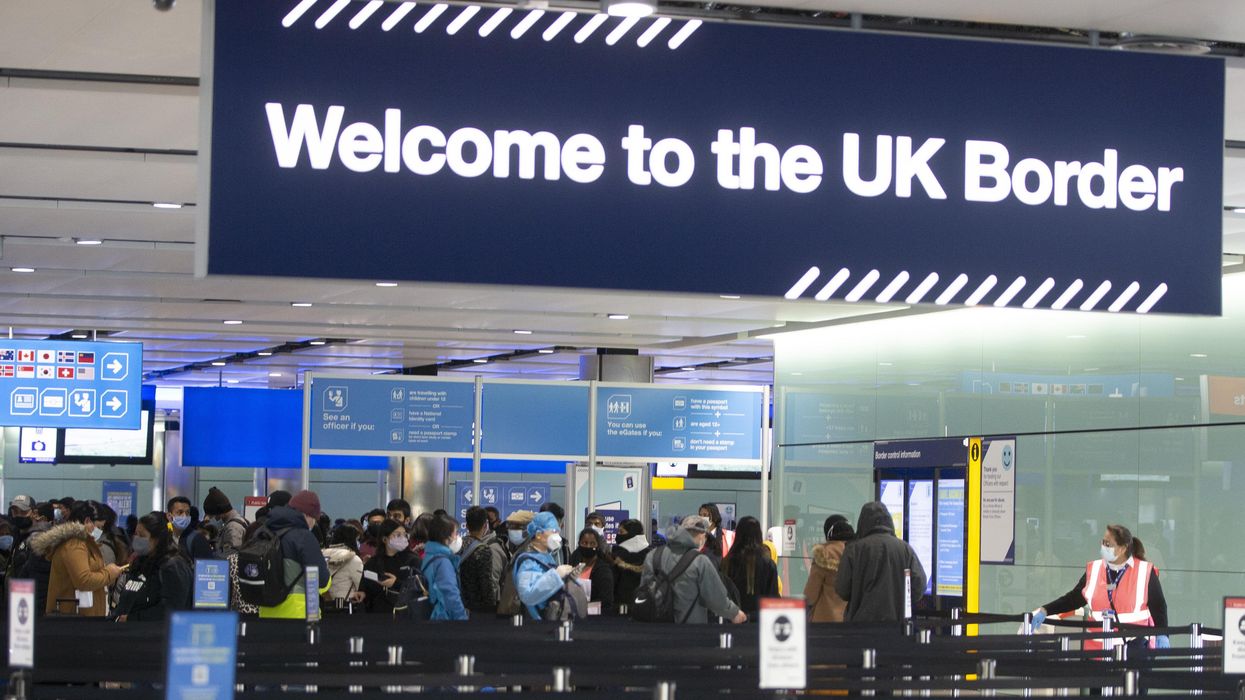 Passengers line up for passport control in the UK Border area of Terminal 2 of Heathrow Airport