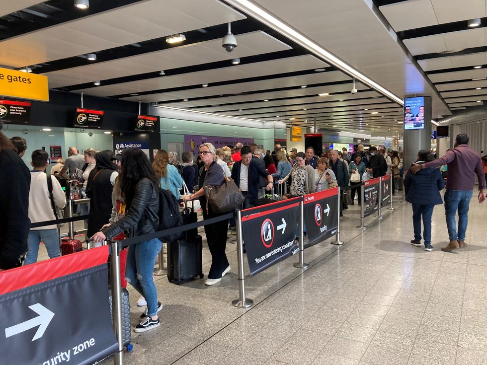 Passengers queue for flights at Heathrow Airport. Picture date: Tuesday May 31, 2022.