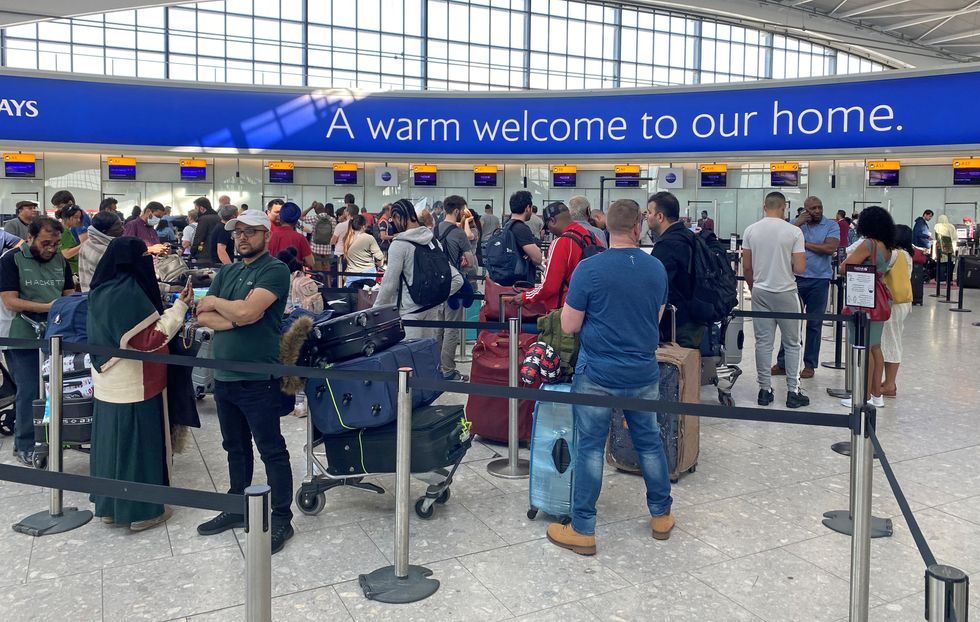 Passengers queue inside the departures area of Terminal 5 at Heathrow Airport in London, during the Easter getaway. Picture date: Friday April 15, 2022.