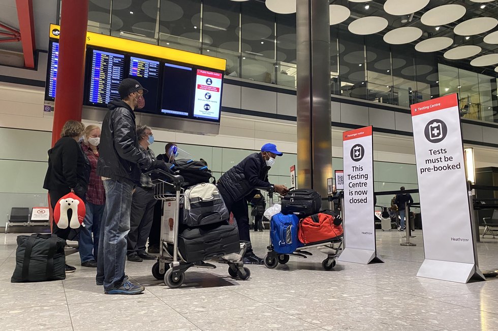 Passengers waiting in line outside the Testing Centre in the Arrival Hall of Terminal 5 at London's Heathrow Airport.