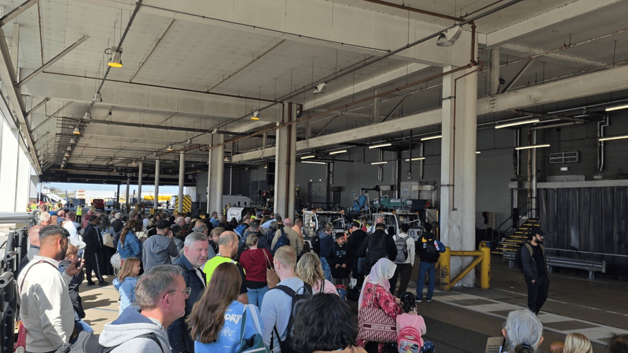 Passengers waiting outside the North Terminal in Birmingham