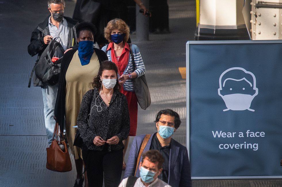 Passengers wearing face masks at Waterloo station in London as face coverings become mandatory on public transport in England with the easing of further lockdown restrictions during the coronavirus pandemic.