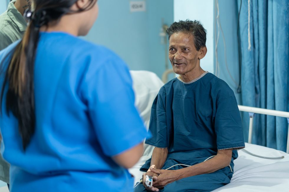 Patient being spoken to via translator