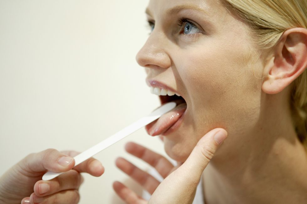 patient sticking tongue out