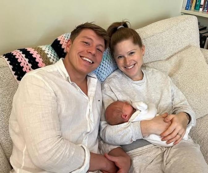 Patrick Christys and Emily Carver with their baby son