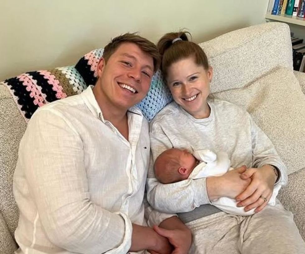 Patrick Christys and Emily Carver with their baby son