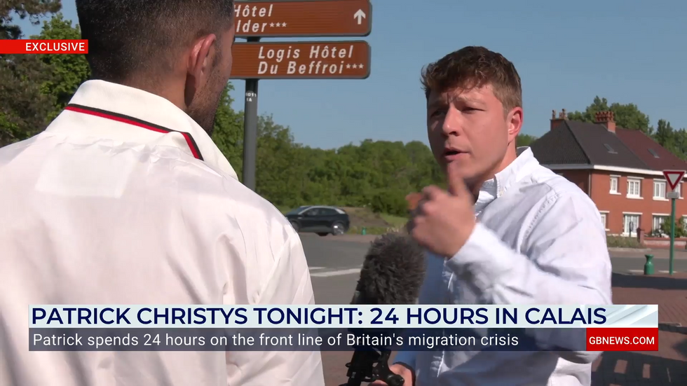Patrick Christys speaks to a migrant