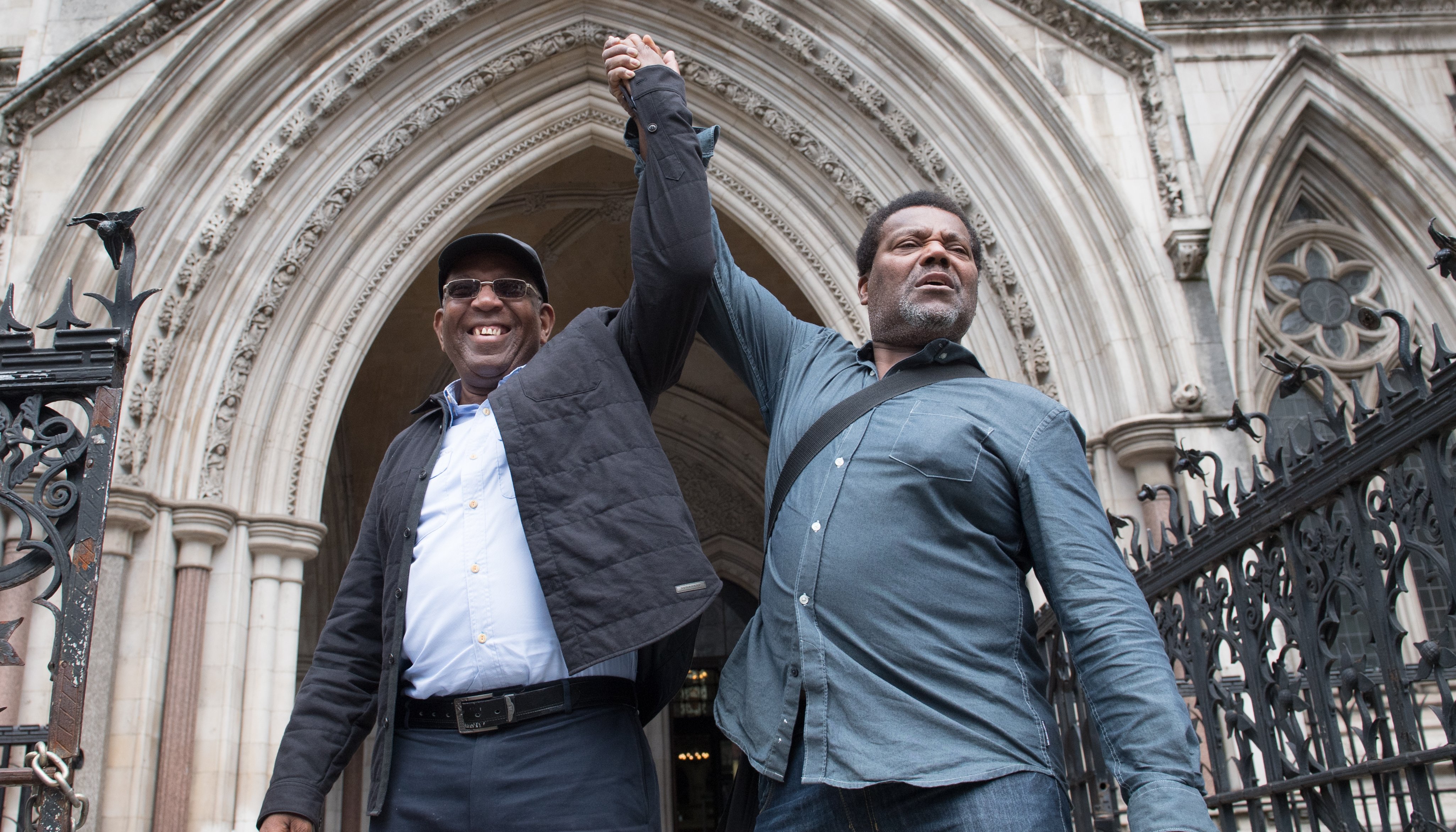 Paul Green (left) and Cleveland Davidson outside the Royal Courts of Justice in London, where the pair along with Courtney Harriot, who were jailed for allegedly attempting to rob a corrupt police officer nearly 50 years ago, have had their convictions overturned by the Court of Appeal.