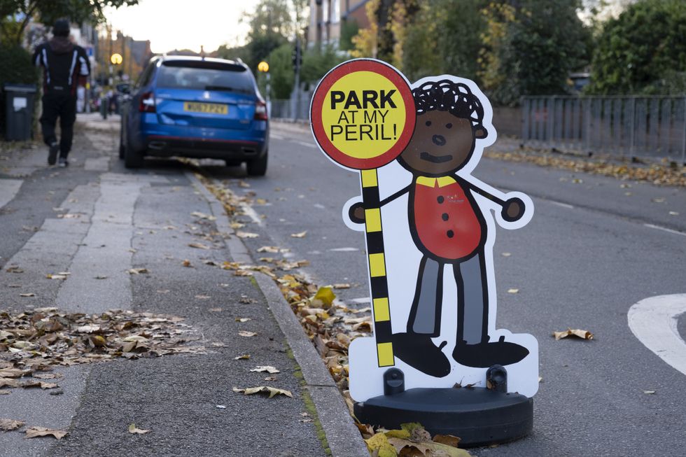 Pavement parking warning sign