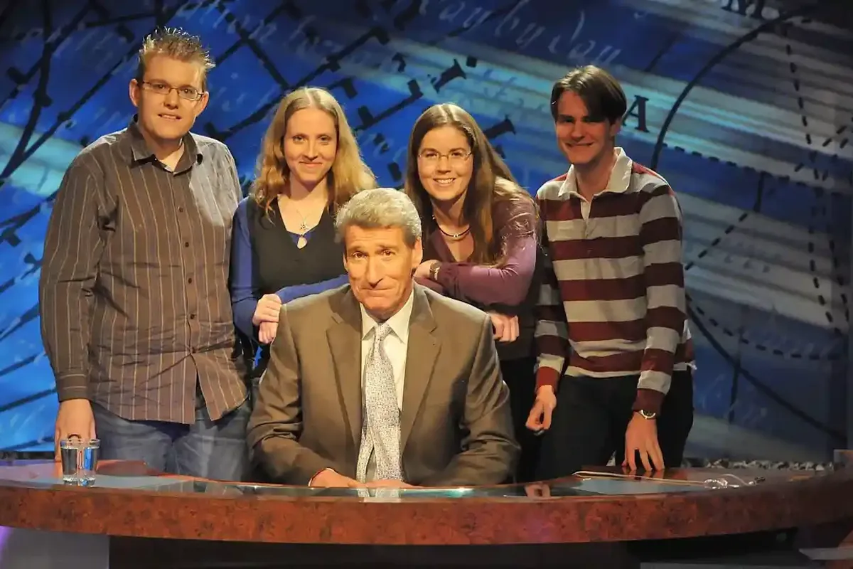 Paxman with a group of University Challenge participants 