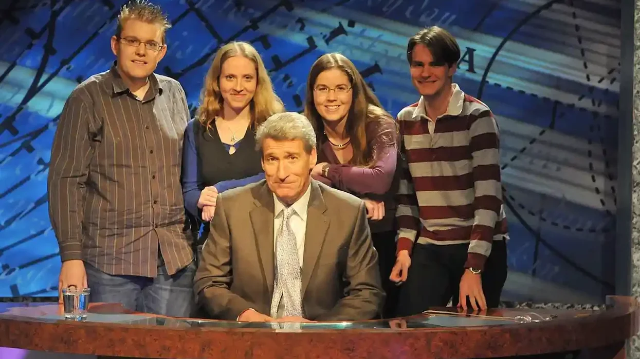 Paxman with a group of University Challenge participants