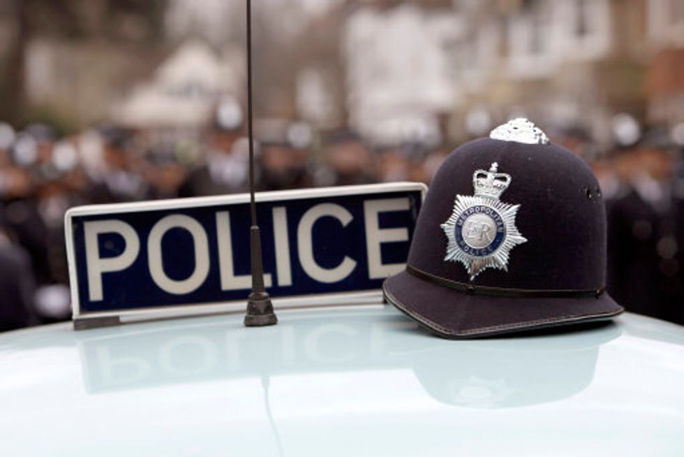 PC Robert Brown arrives by vintage car at Croydon Police Station in south London. The country's longest-serving officer is retiring after 47 years of service, he was greeted by a guard of honour by colleagues, including officers from Croydon and the Met's dog unit.
