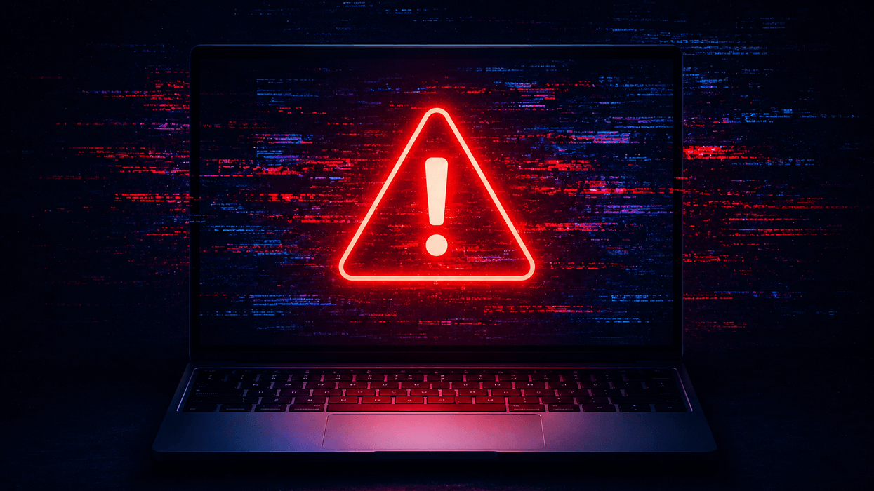 PC with red warning symbol on screen with red and blue glitch
