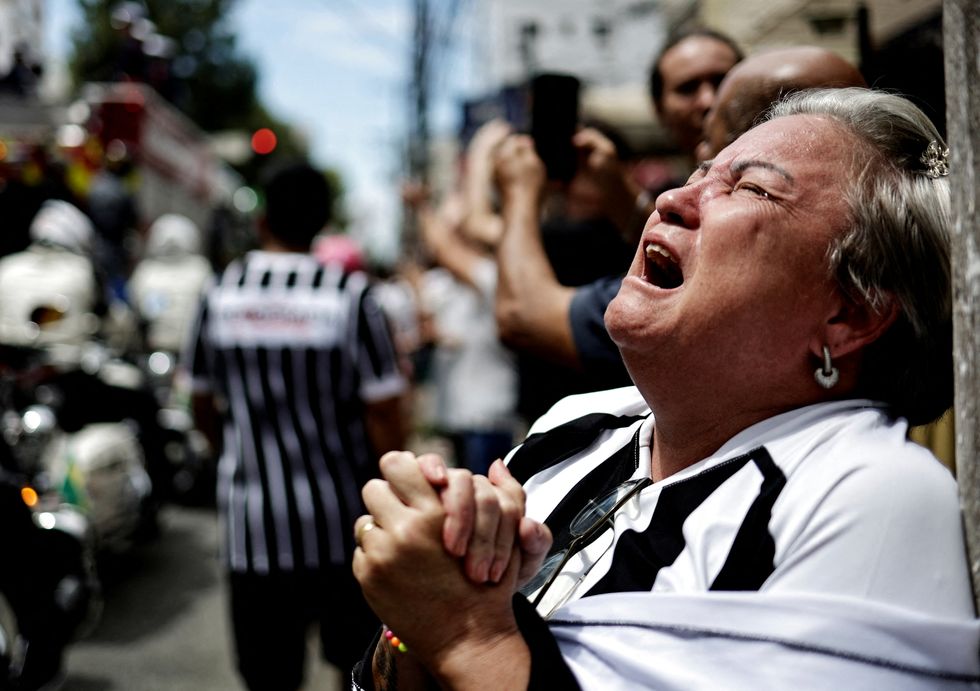 Pele funeral: Fans cried as the funeral procession passed through Santos