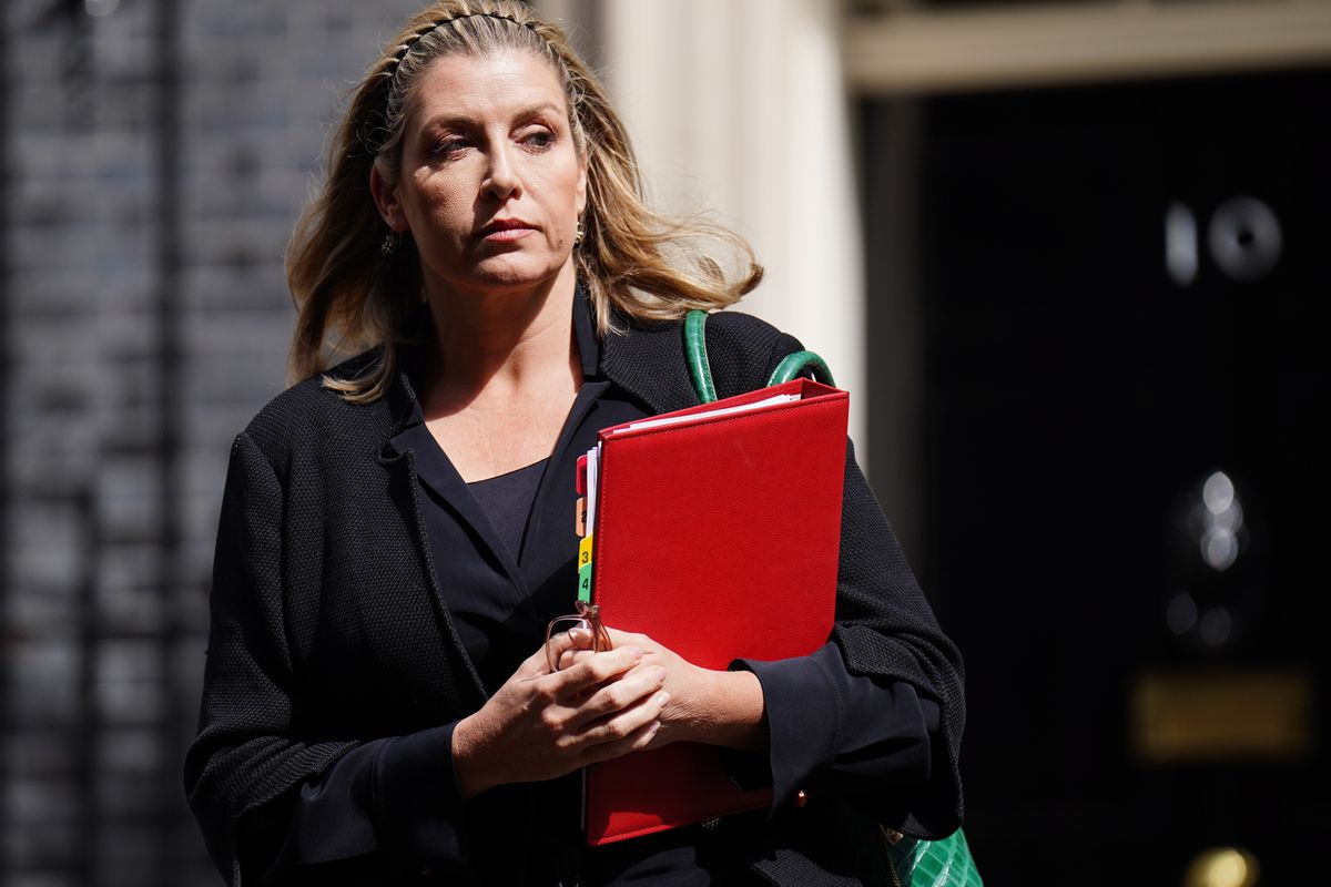 Penny Mordaunt with red binder