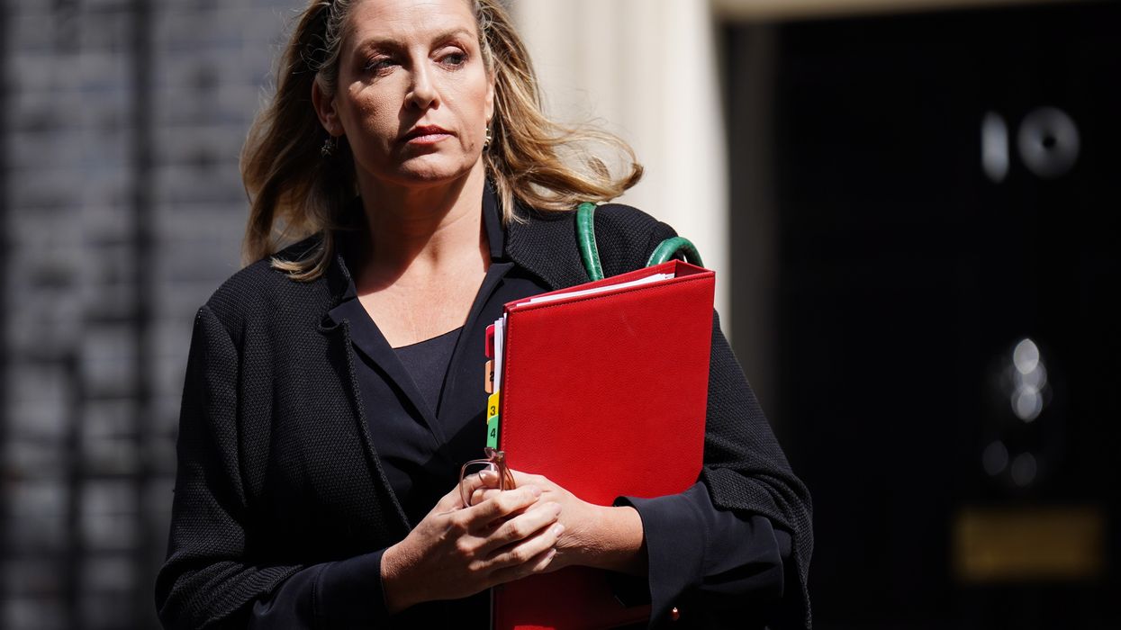 Penny Mordaunt with red binder