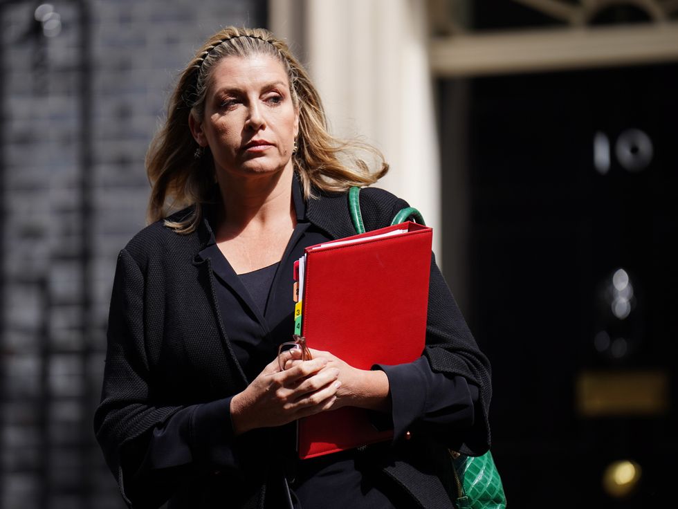 Penny Mordaunt with red binder