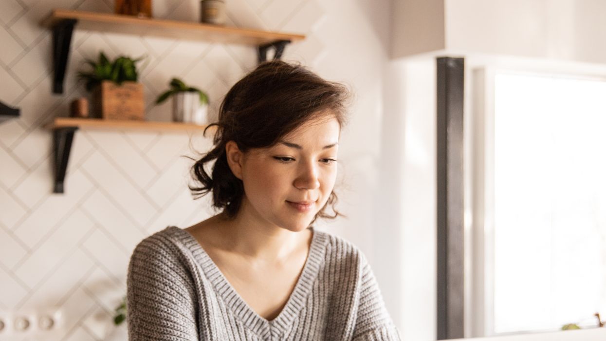 Pension saver looks at laptop