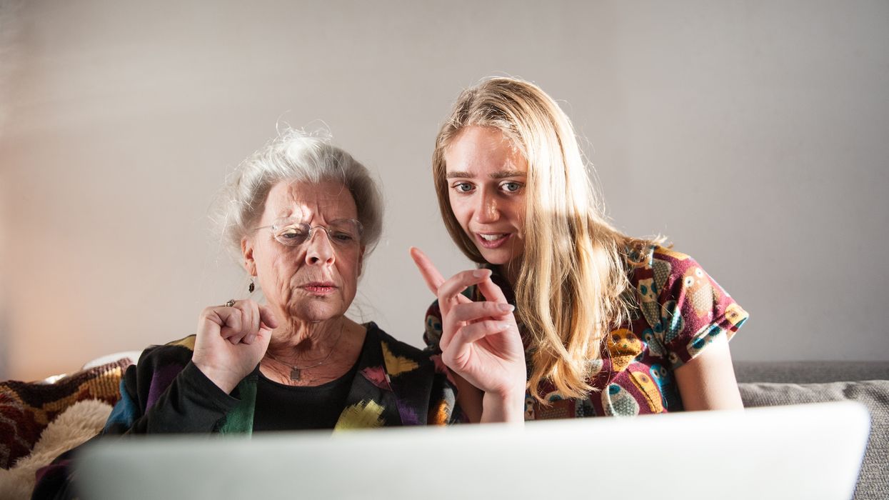 Pensioner and young person look worried