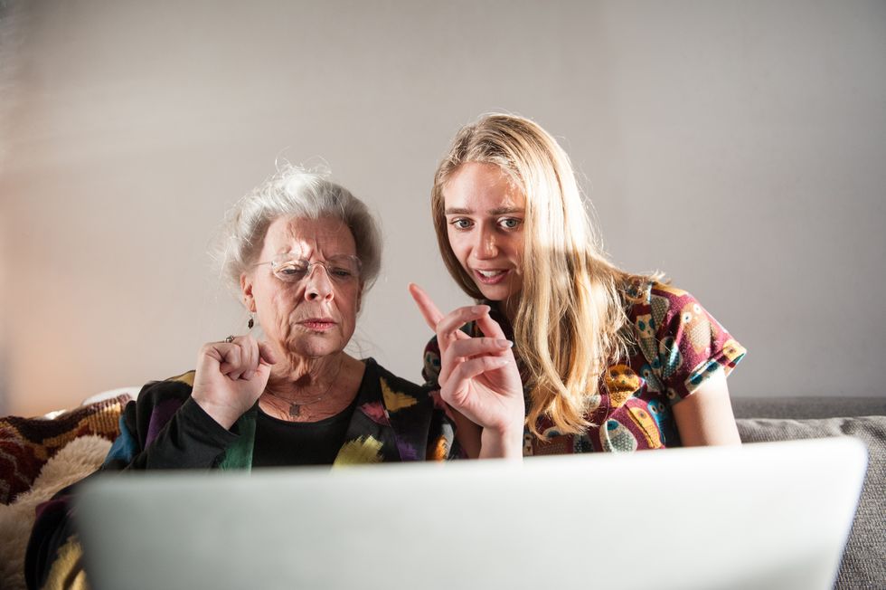 Pensioner and young person look worried