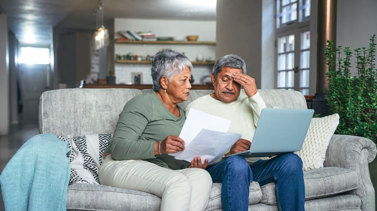 Pensioner couple looking at documents